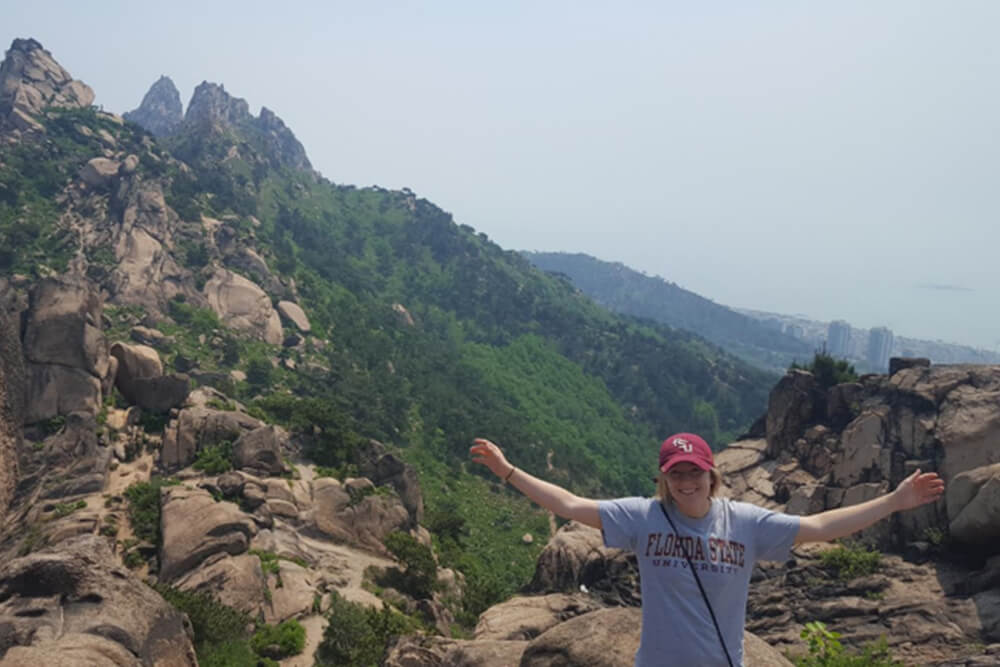 Intern hiking a mountain in China